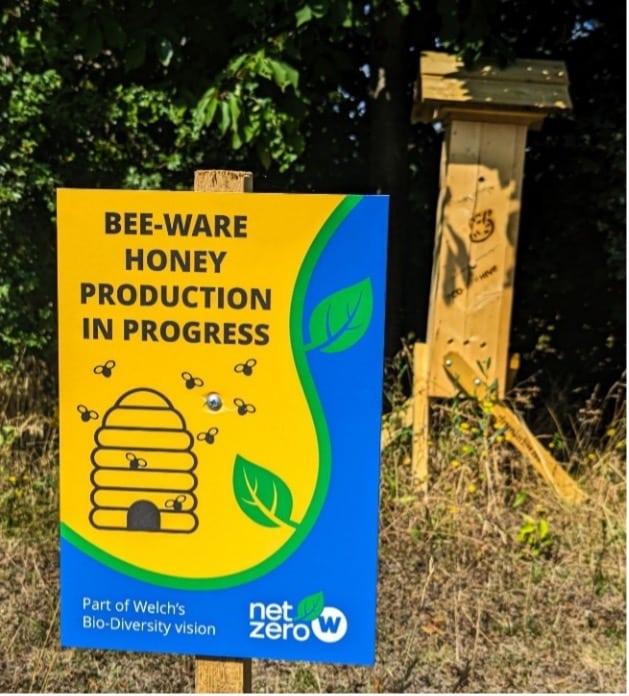 A sign indicating the location of one of Welch’s beehives.